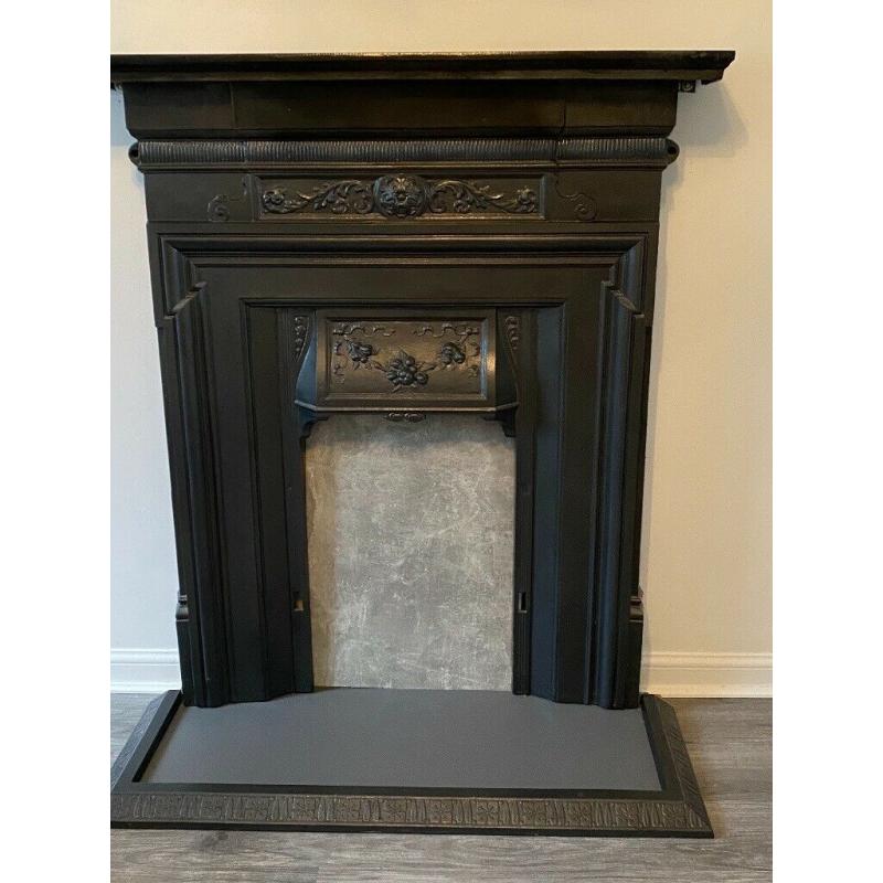 Beautiful black original cast iron fireplace with fender! Refurbished and in good condition