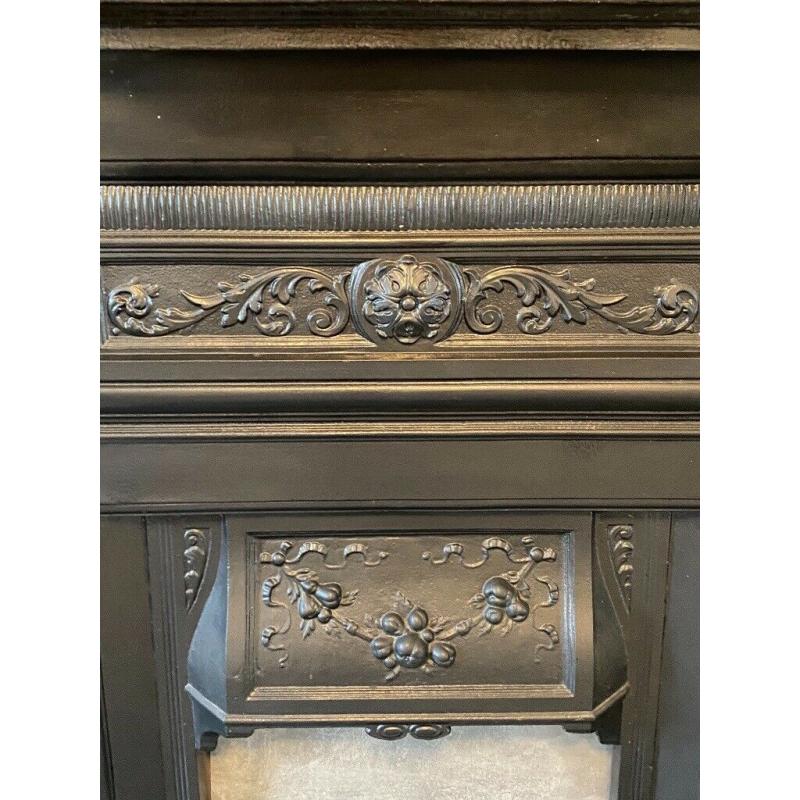 Beautiful black original cast iron fireplace with fender! Refurbished and in good condition