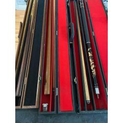 Three snooker pool cues with cases