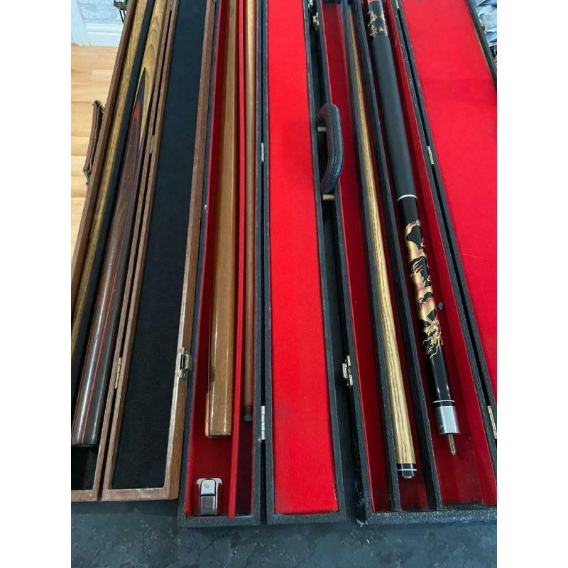 Three snooker pool cues with cases