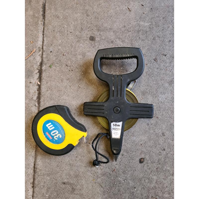 Long measuring tapes landscaper building landscaping
