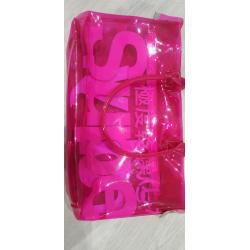 Neon pink transparent plastic Superdry bag