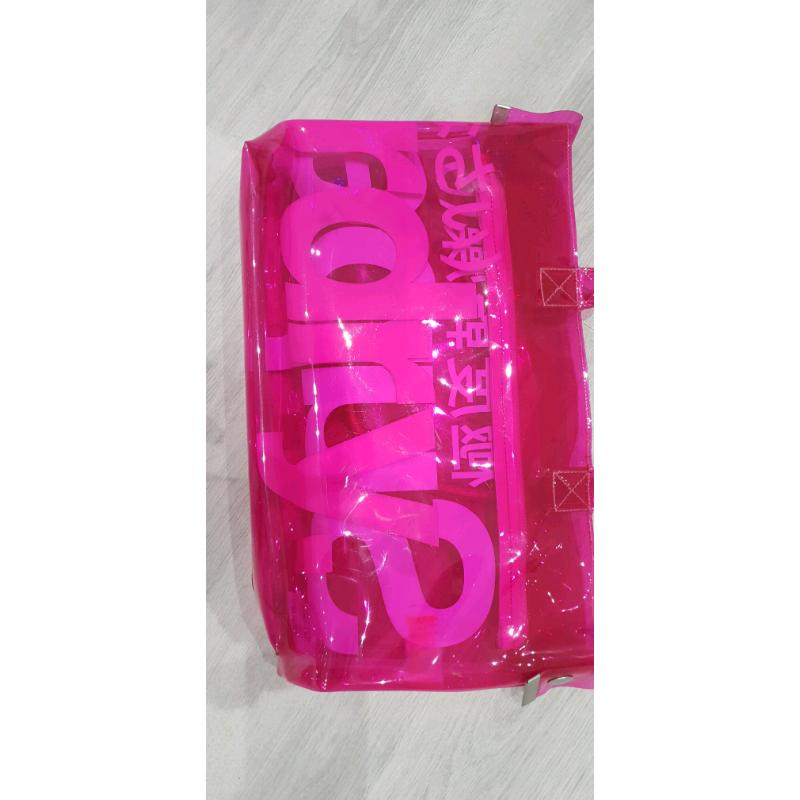Neon pink transparent plastic Superdry bag
