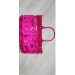 Neon pink transparent plastic Superdry bag