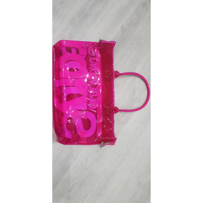 Neon pink transparent plastic Superdry bag