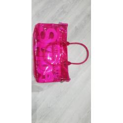 Neon pink transparent plastic Superdry bag