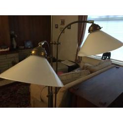 brass reading lights with two shades.
