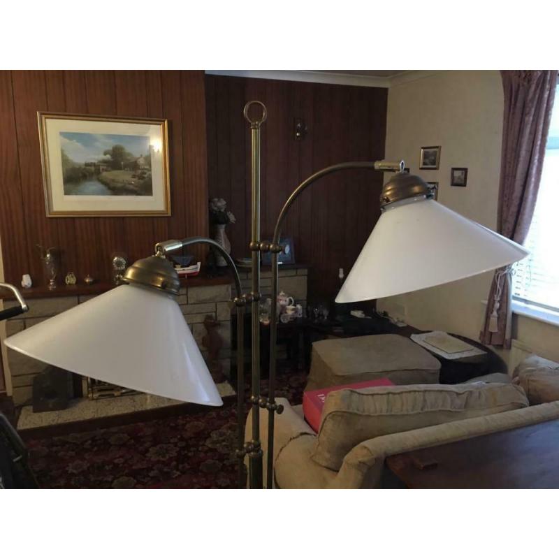 brass reading lights with two shades.