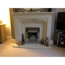 Solid stone mantelpiece with gas pebble effect fire