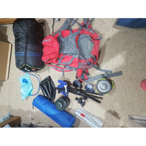 Camping gear: backpack, cooking gear, water bladder, double sleeping bag, lights, sleeping mat