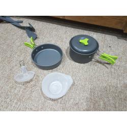 Camping gear: backpack, cooking gear, water bladder, double sleeping bag, lights, sleeping mat