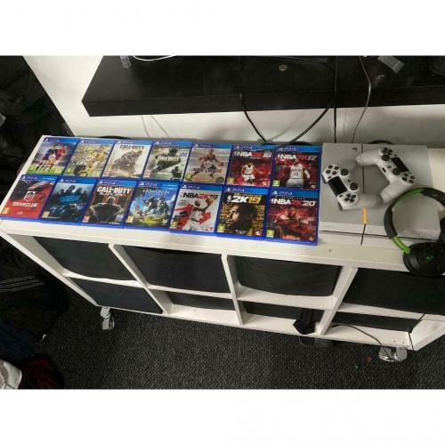 White PlayStation 4 with 14 games 2 controllers and Turtle Beach Headset.