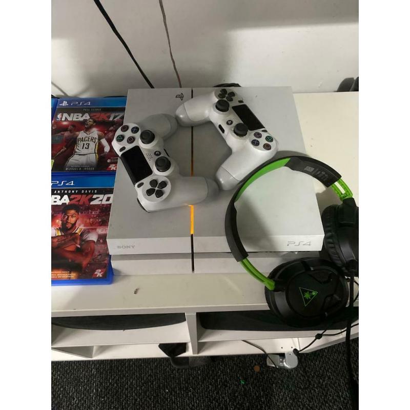 White PlayStation 4 with 14 games 2 controllers and Turtle Beach Headset.