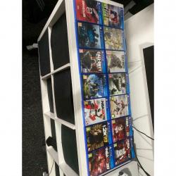 White PlayStation 4 with 14 games 2 controllers and Turtle Beach Headset.