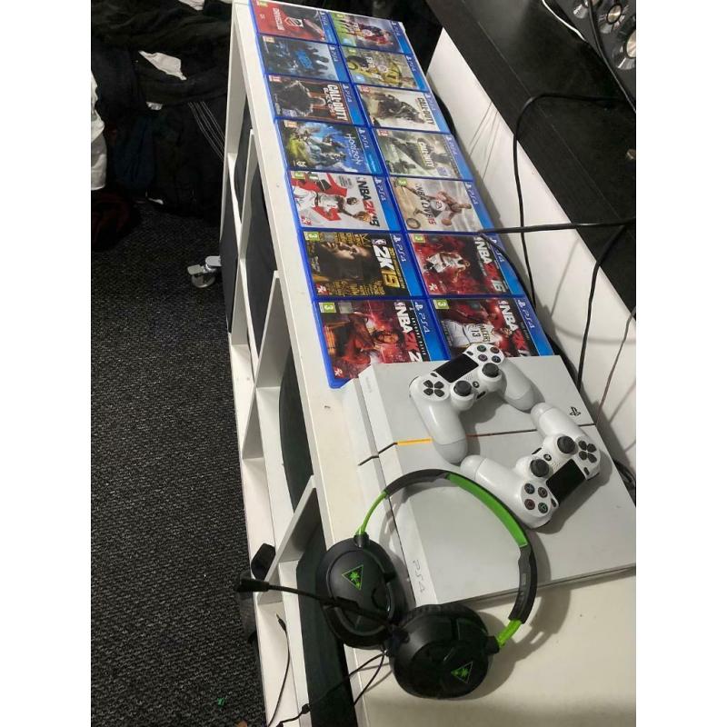 White PlayStation 4 with 14 games 2 controllers and Turtle Beach Headset.