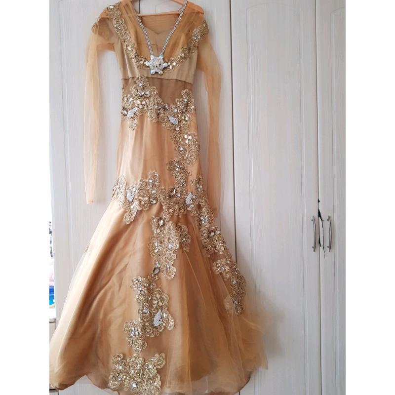 Gold gown for sale, size 8 in great condition.