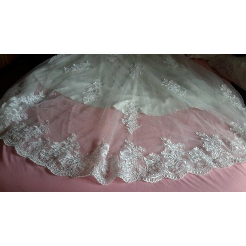 Cream wedding dress size 10/12 and needs someone at least 5ft9ins tall