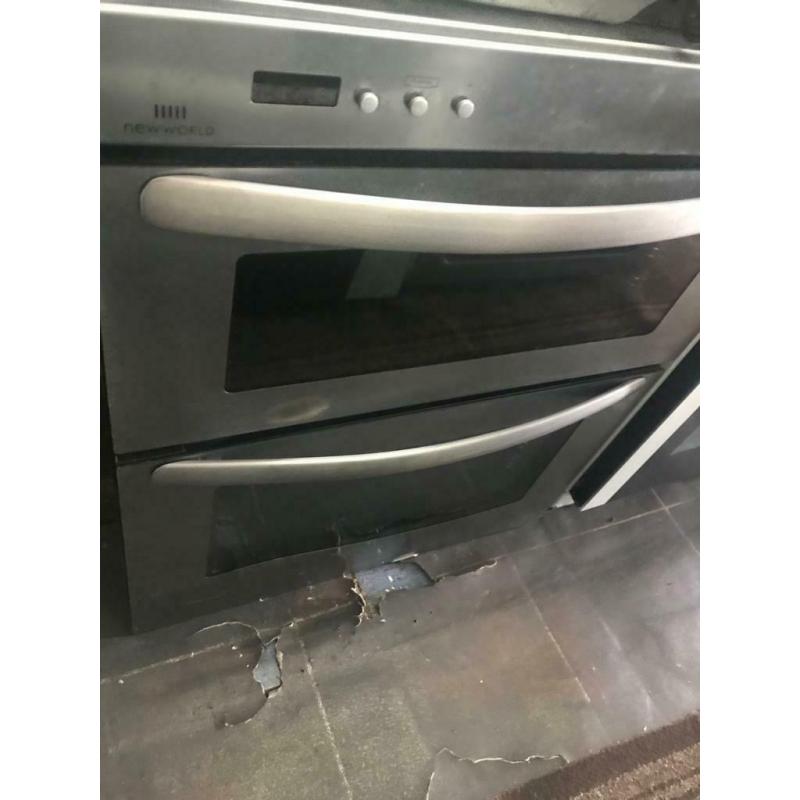 Stainless steel new world 70cm by 60cm integrated grill & gas ovens good condition with guarantee