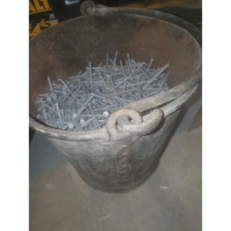Vintage fire bucket 3/4 full with galvanised nails
