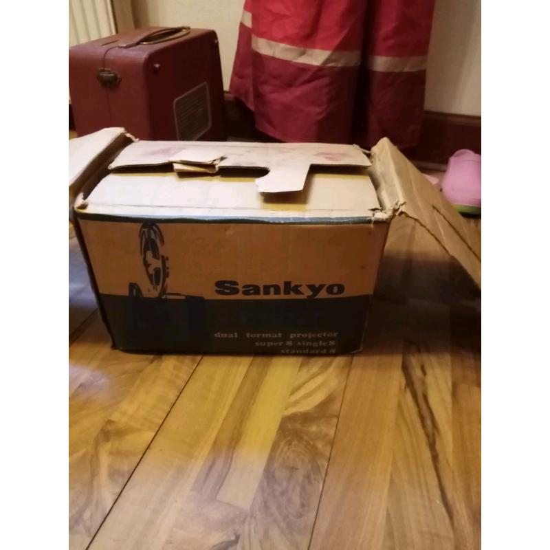 Sankyo dualux 1000 cine projector and projector screen