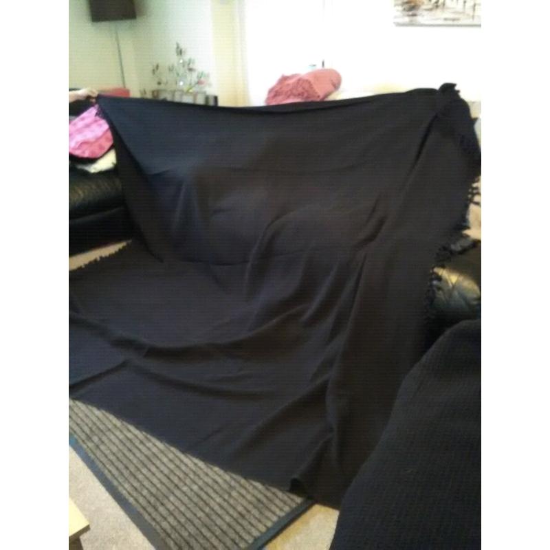 Two large black throws