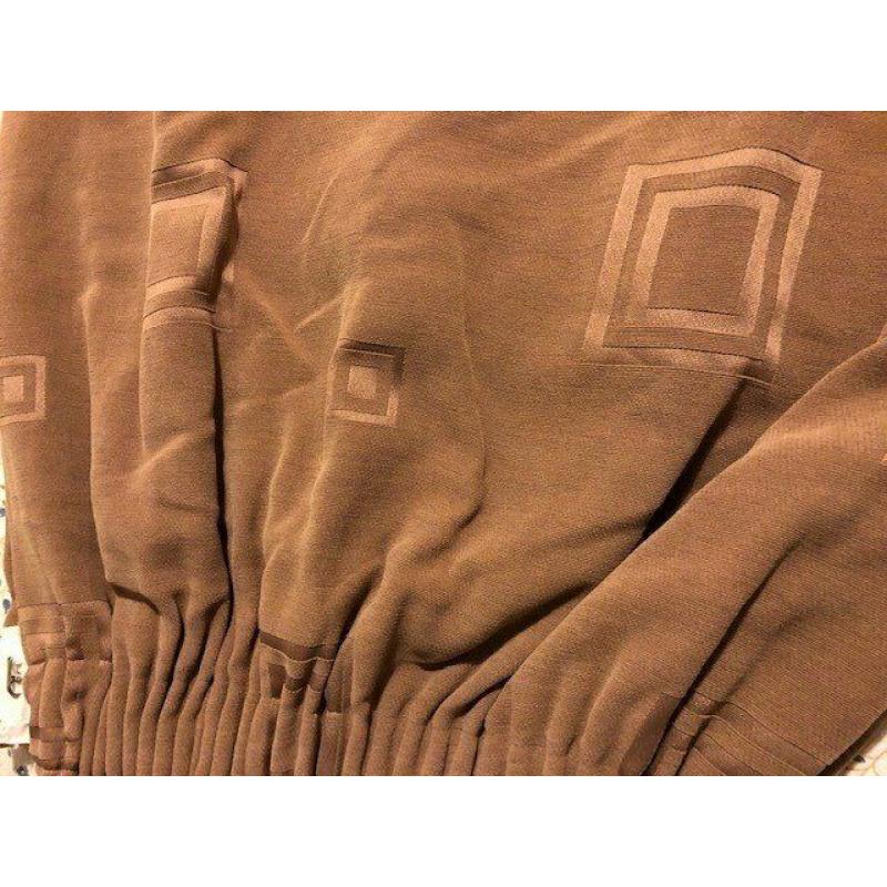 Curtains mid brown lined curtains.