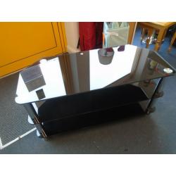 WIDE BLACK GLASS TV STAND at Haven Trust's charity shop at 247 Radford Road, NG7 5GU