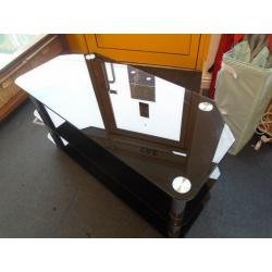WIDE BLACK GLASS TV STAND at Haven Trust's charity shop at 247 Radford Road, NG7 5GU