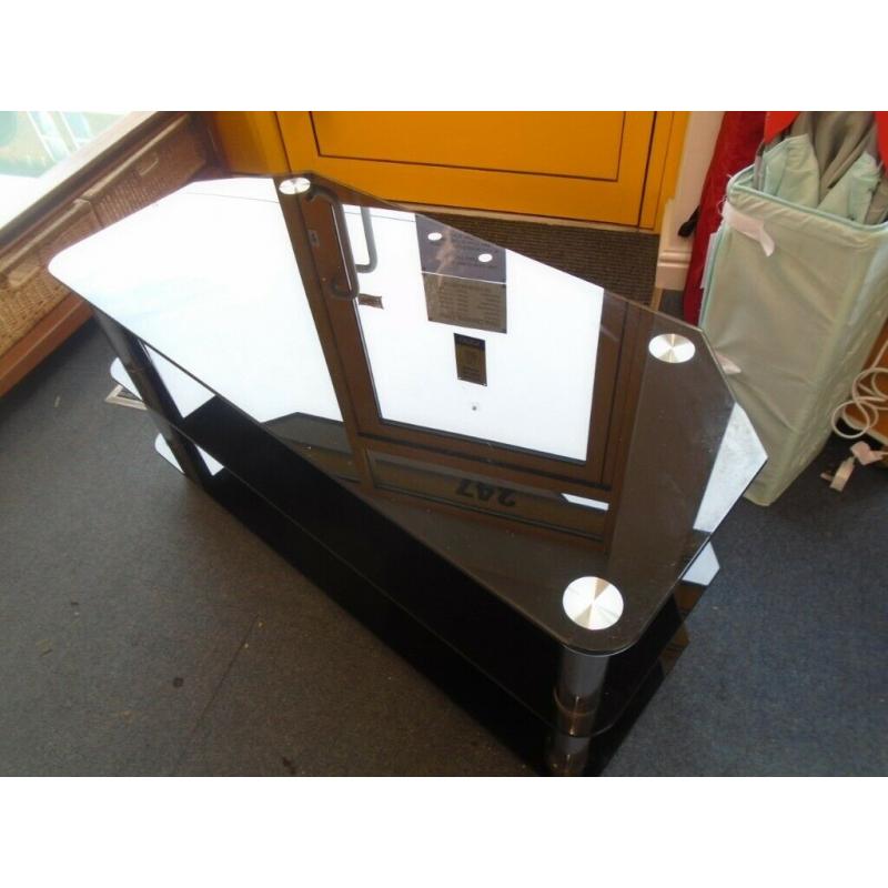 WIDE BLACK GLASS TV STAND at Haven Trust's charity shop at 247 Radford Road, NG7 5GU