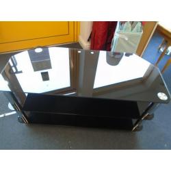 WIDE BLACK GLASS TV STAND at Haven Trust's charity shop at 247 Radford Road, NG7 5GU