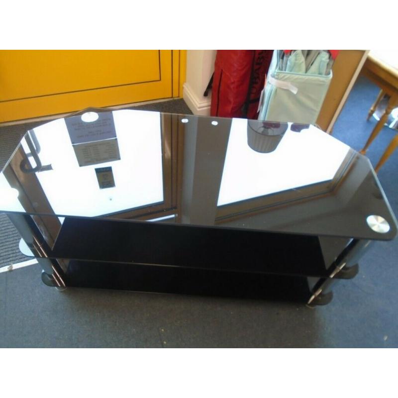 WIDE BLACK GLASS TV STAND at Haven Trust's charity shop at 247 Radford Road, NG7 5GU