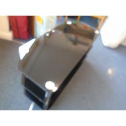 WIDE BLACK GLASS TV STAND at Haven Trust's charity shop at 247 Radford Road, NG7 5GU