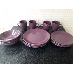 Set of purple matching plates and bowls