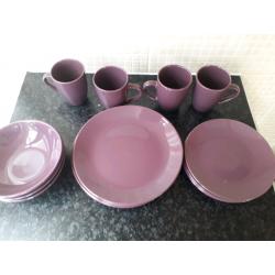 Set of purple matching plates and bowls