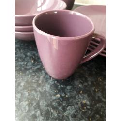 Set of purple matching plates and bowls