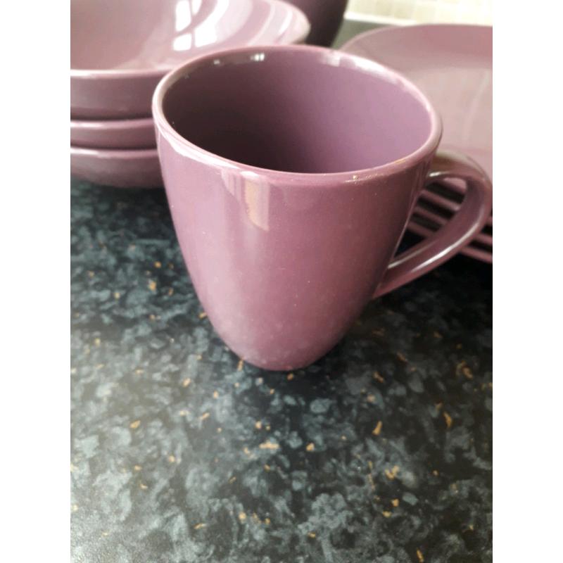 Set of purple matching plates and bowls
