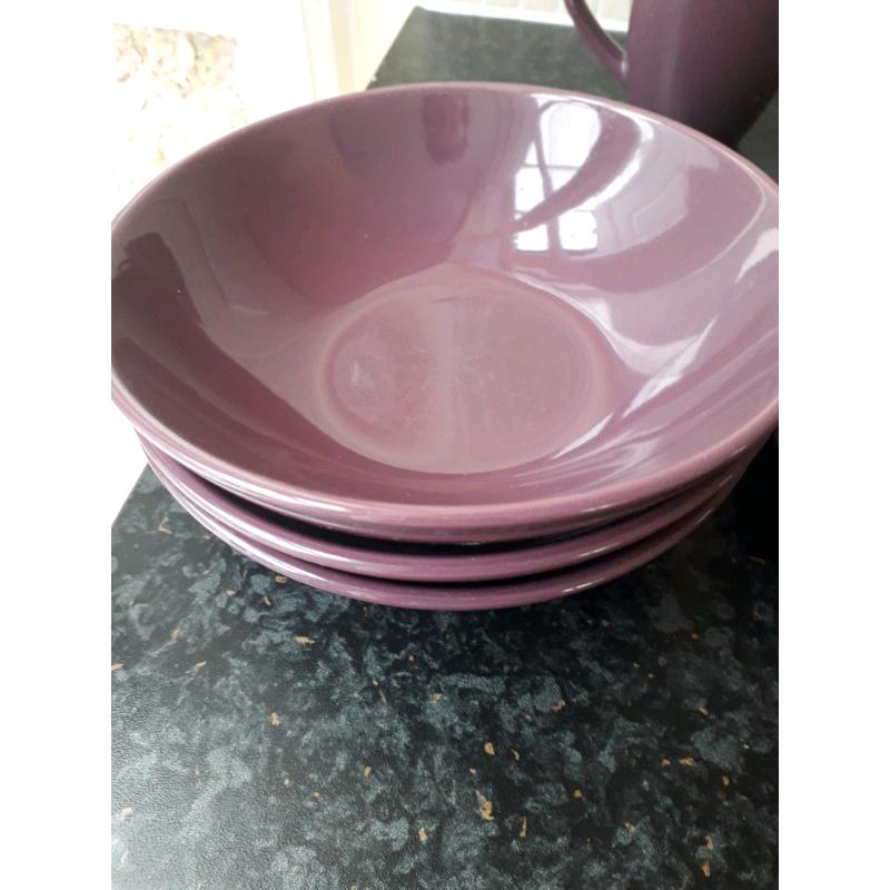 Set of purple matching plates and bowls
