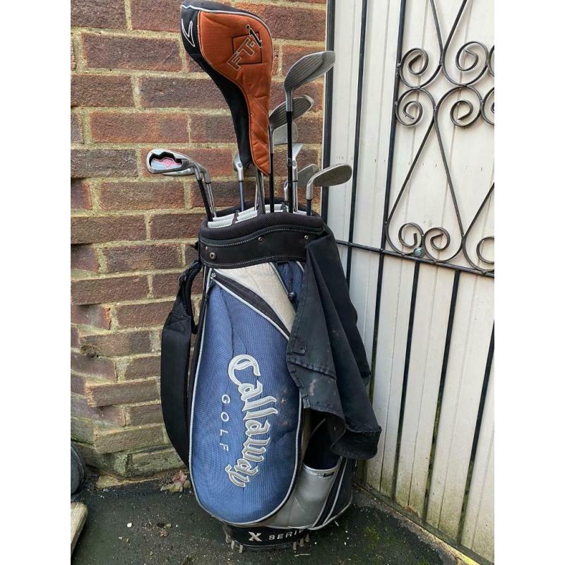 Various golf clubs and bag