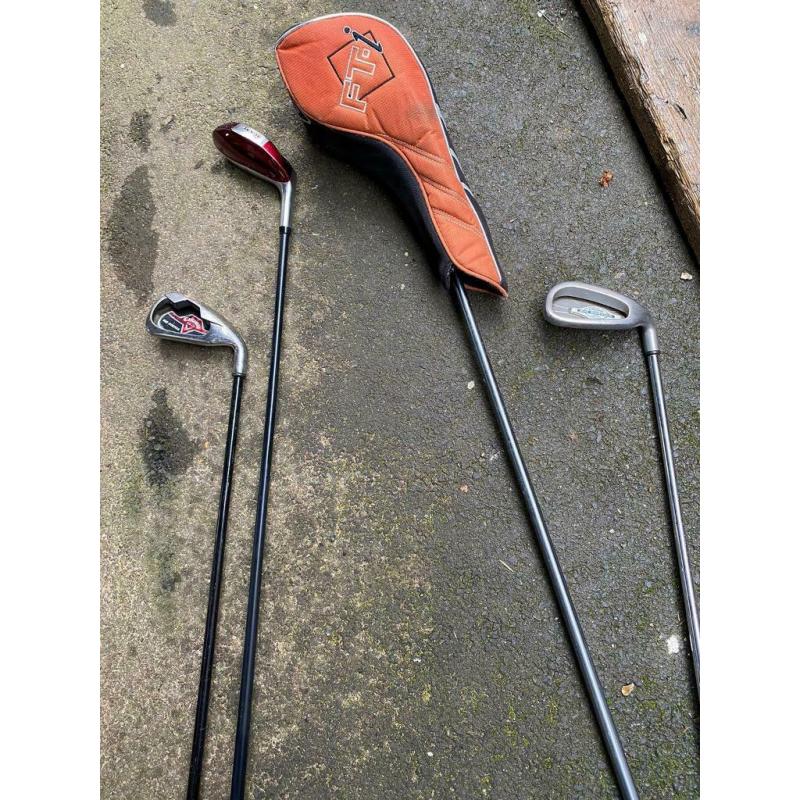 Various golf clubs and bag