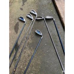 Various golf clubs and bag